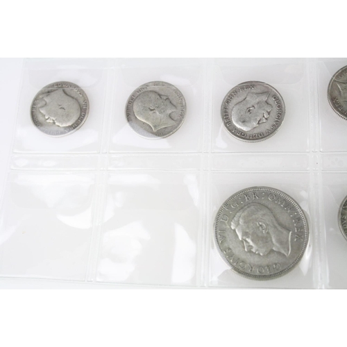 74 - A collection of British pre decimal silver coins to include King Edward VII shillings, King George V... 