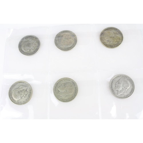 74 - A collection of British pre decimal silver coins to include King Edward VII shillings, King George V... 