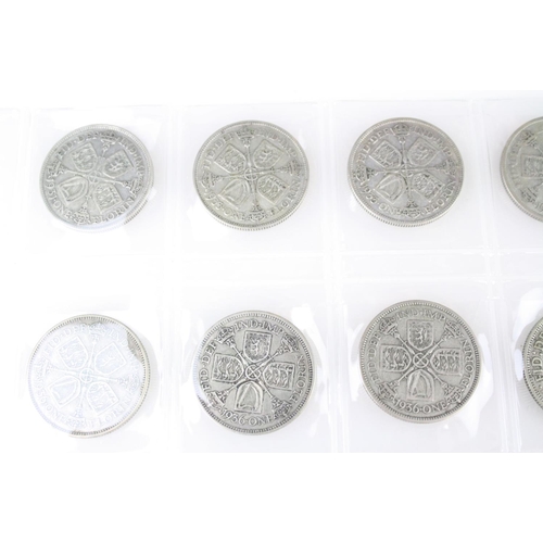 74 - A collection of British pre decimal silver coins to include King Edward VII shillings, King George V... 