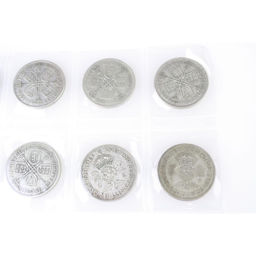 74 - A collection of British pre decimal silver coins to include King Edward VII shillings, King George V... 