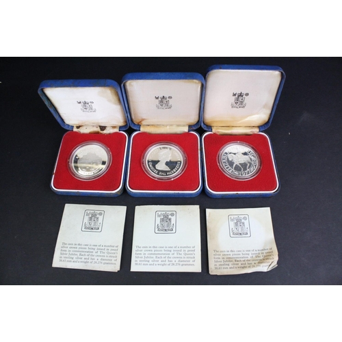 77 - A collection of three cased silver proof coins with COA's to include a Royal Mint 1977 silver proof ... 