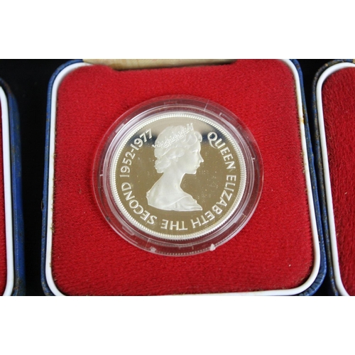 77 - A collection of three cased silver proof coins with COA's to include a Royal Mint 1977 silver proof ... 