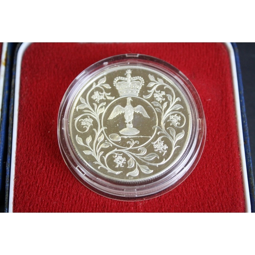 77 - A collection of three cased silver proof coins with COA's to include a Royal Mint 1977 silver proof ... 