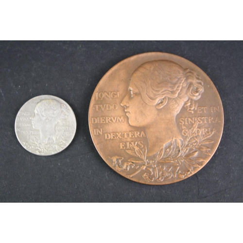 100 - A 1837-1897 Queen Victoria Diamond Jubilee bronze medal together with a matching smaller silver exam... 