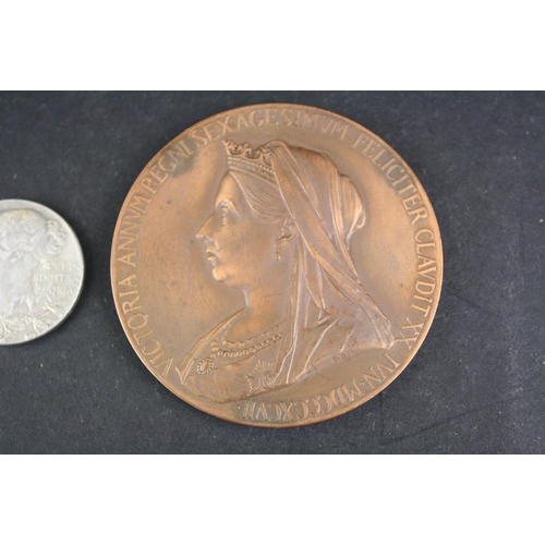 100 - A 1837-1897 Queen Victoria Diamond Jubilee bronze medal together with a matching smaller silver exam... 