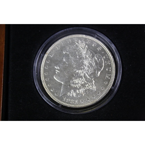 106 - A London Mint Office 'The Last Ever U.S. Morgan Dollar', dated 1921 and in fitted display case compl... 