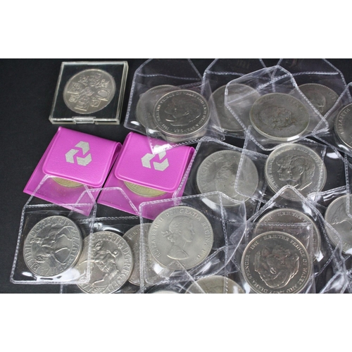 79 - A large collection of British commemorative crown coins.