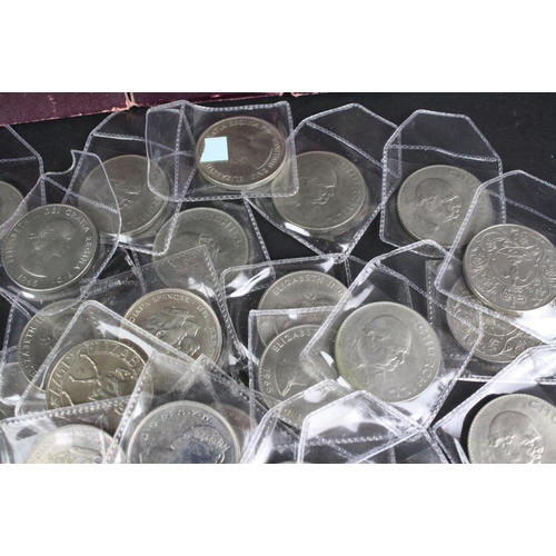 79 - A large collection of British commemorative crown coins.