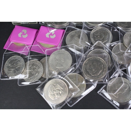 79 - A large collection of British commemorative crown coins.