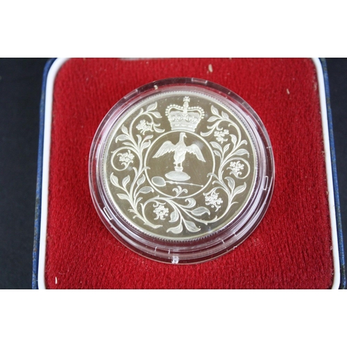 80 - A collection of three cased silver proof coins with COA's to include a Royal Mint 1977 silver proof ... 