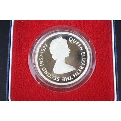 80 - A collection of three cased silver proof coins with COA's to include a Royal Mint 1977 silver proof ... 