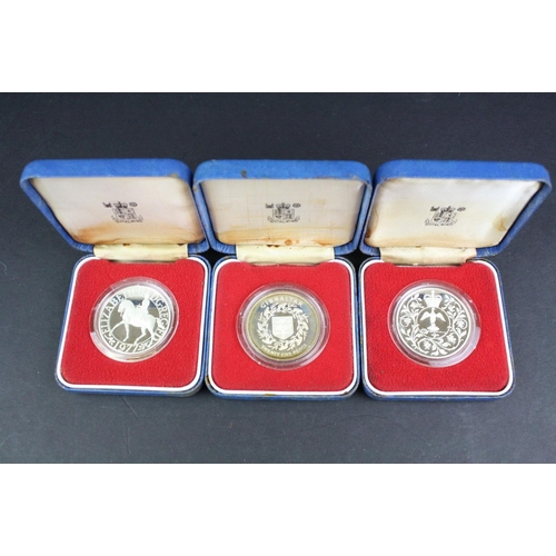 85 - A collection of three cased silver proof coins with COA's to include a Royal Mint 1977 silver proof ... 