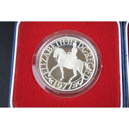 85 - A collection of three cased silver proof coins with COA's to include a Royal Mint 1977 silver proof ... 