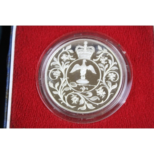 85 - A collection of three cased silver proof coins with COA's to include a Royal Mint 1977 silver proof ... 