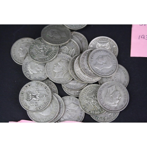 89 - A large collection of British pre decimal shilling coins to include pre 1947 silver examples.