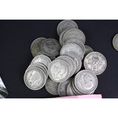 89 - A large collection of British pre decimal shilling coins to include pre 1947 silver examples.