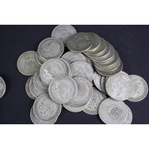 89 - A large collection of British pre decimal shilling coins to include pre 1947 silver examples.