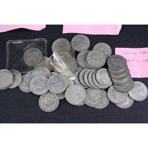 89 - A large collection of British pre decimal shilling coins to include pre 1947 silver examples.