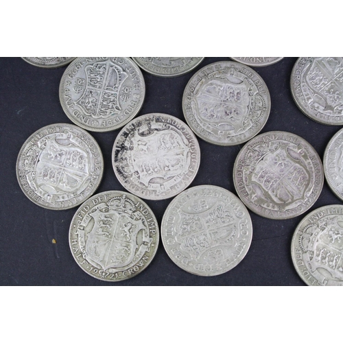 93 - A collection of approx twenty four King George V silver half crown coins.