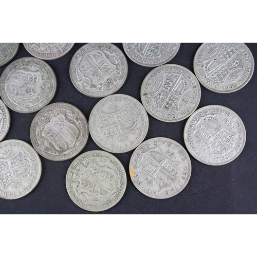 93 - A collection of approx twenty four King George V silver half crown coins.