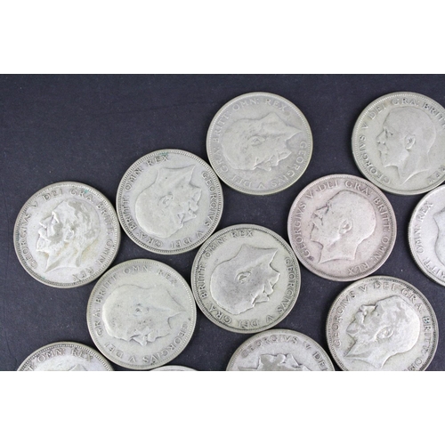 93 - A collection of approx twenty four King George V silver half crown coins.