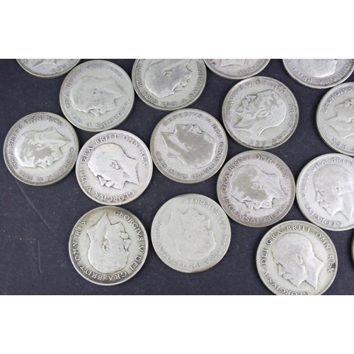 93 - A collection of approx twenty four King George V silver half crown coins.