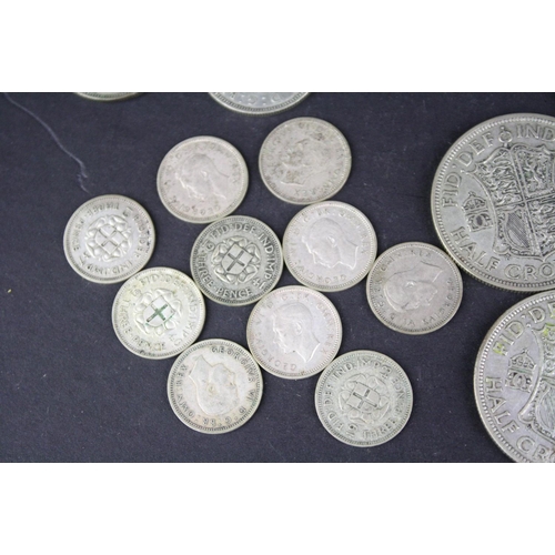 94 - A collection of British pre decimal King George VI coins to include half crowns, shillings, sixpence... 