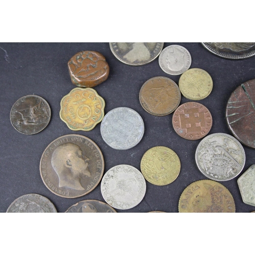 97 - A small collection of British pre decimal and foreign coins to include silver examples.