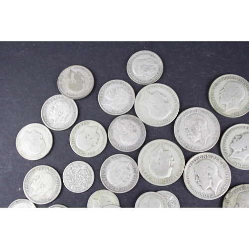 98 - A collection of British pre decimal King George V silver coins to include Florins, Shillings, sixpen... 