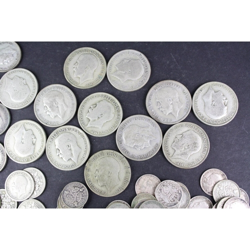 98 - A collection of British pre decimal King George V silver coins to include Florins, Shillings, sixpen... 