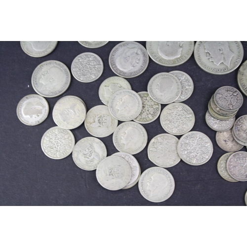 98 - A collection of British pre decimal King George V silver coins to include Florins, Shillings, sixpen... 