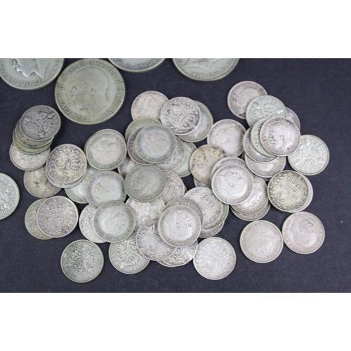 98 - A collection of British pre decimal King George V silver coins to include Florins, Shillings, sixpen... 