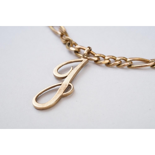 105 - 9ct yellow gold pendant necklace, the pendant styled as the letter 'J', figaro link 9ct yellow gold ... 