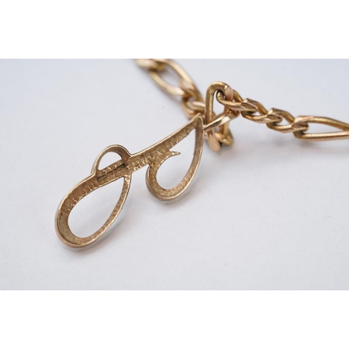 105 - 9ct yellow gold pendant necklace, the pendant styled as the letter 'J', figaro link 9ct yellow gold ... 