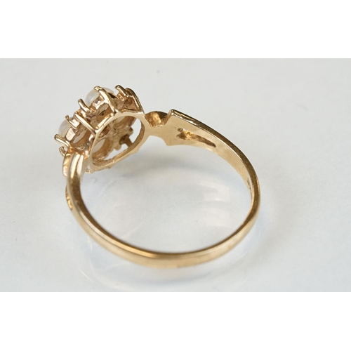 107 - Three 9ct yellow gold dress rings, comprising a diamond three tier cluster ring, ring size P½; a pea... 