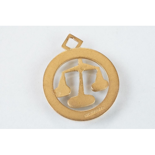 116 - 9ct yellow gold pendant, modelled as the star sign libra, diameter approx 21mm