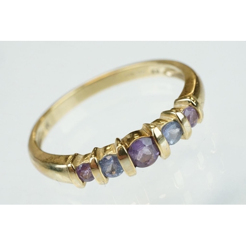 301 - Amethyst and iolite 9ct yellow gold five stone dress ring, shared bar settings, ring size T; togethe... 