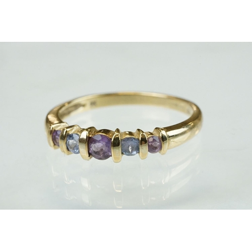 301 - Amethyst and iolite 9ct yellow gold five stone dress ring, shared bar settings, ring size T; togethe... 