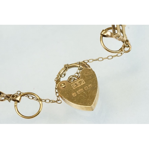 309 - 9ct gold gate link bracelet, padlock clasp, width approx 8.5mm