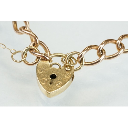 310 - 9ct rose gold curb link bracelet with 9ct yellow gold padlock clasp