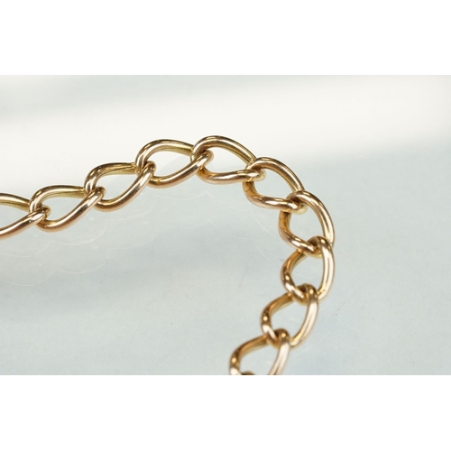 310 - 9ct rose gold curb link bracelet with 9ct yellow gold padlock clasp