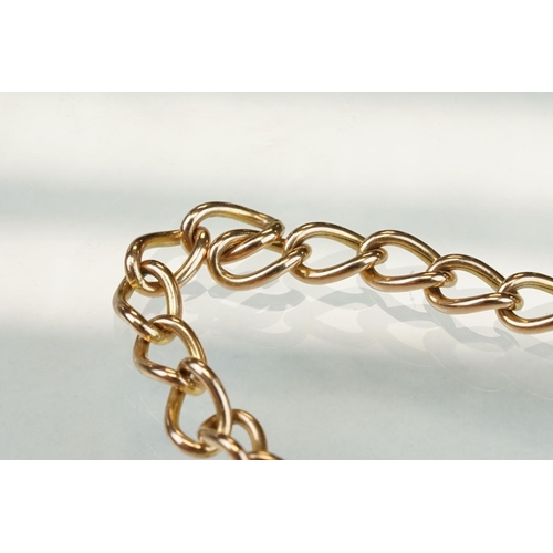 310 - 9ct rose gold curb link bracelet with 9ct yellow gold padlock clasp