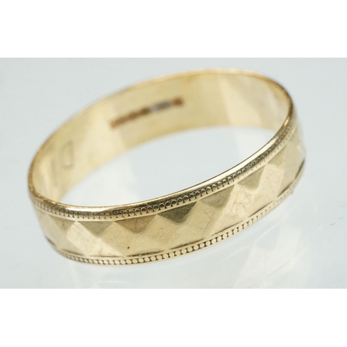 312 - 9ct yellow gold faceted wedding band, width approx 4.5mm, ring size Q½; together with a 9ct yellow g... 