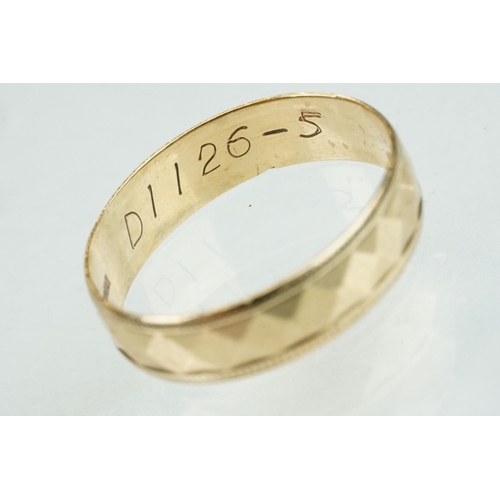 312 - 9ct yellow gold faceted wedding band, width approx 4.5mm, ring size Q½; together with a 9ct yellow g... 