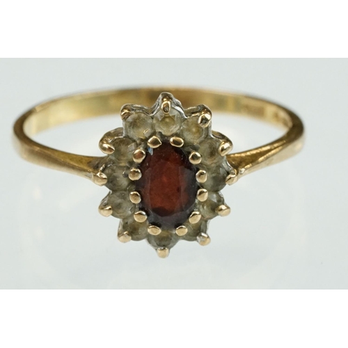 314 - Diamond 9ct yellow gold dress ring, size L½; together with a garnet and white stone 9ct yellow gold ... 