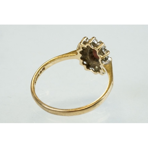 314 - Diamond 9ct yellow gold dress ring, size L½; together with a garnet and white stone 9ct yellow gold ... 