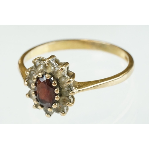 314 - Diamond 9ct yellow gold dress ring, size L½; together with a garnet and white stone 9ct yellow gold ... 