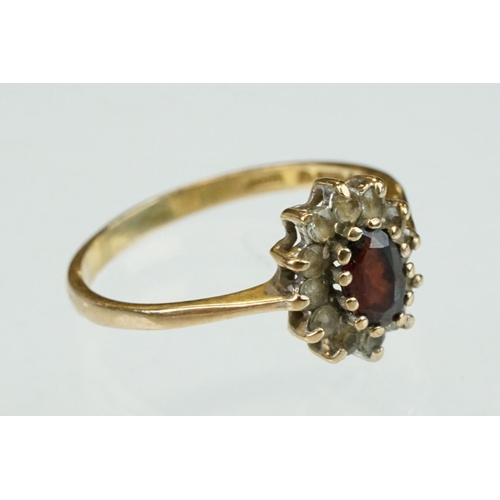 314 - Diamond 9ct yellow gold dress ring, size L½; together with a garnet and white stone 9ct yellow gold ... 