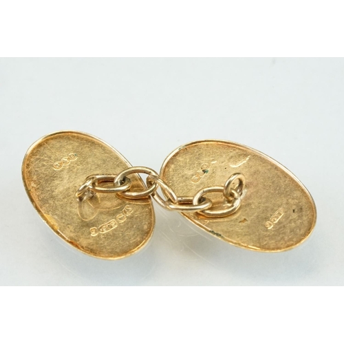 318 - Pair of 9ct yellow gold cufflinks, oval panels, plain polished and engine turned design, chain links... 