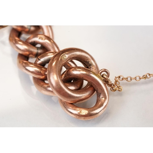 331 - 9ct rose gold curb link bracelet, each link stamped 9c, later 9ct gold padlock clasp and five 9ct ye... 